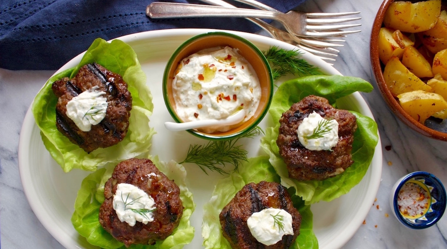 Lettuce-wrapped Lamb Sliders with Greek Feta + Yogurt Sauce